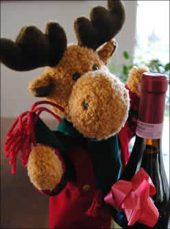 plush reindeer with a bottle of wine